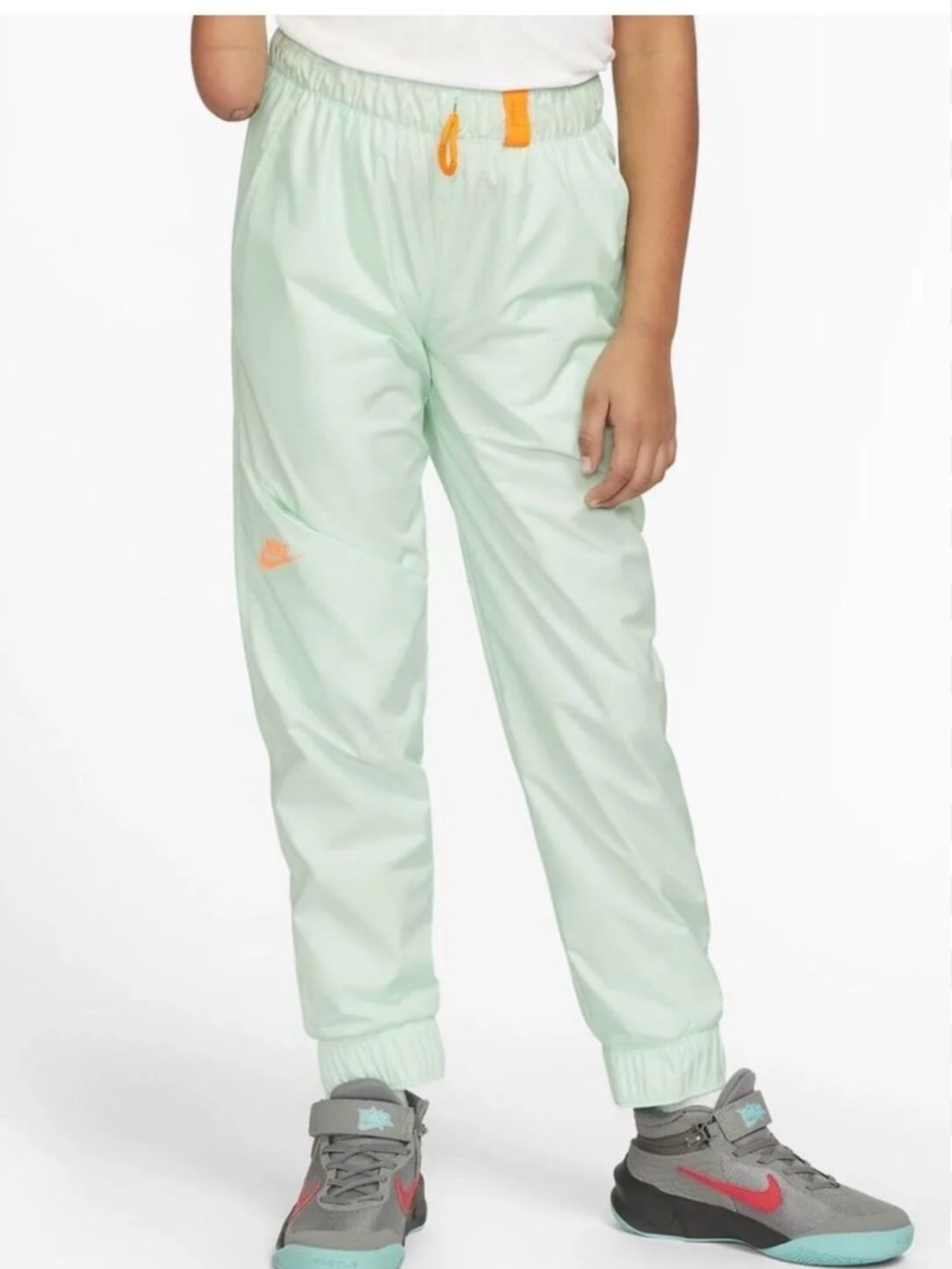 Nike Kids' Mint Green Track Pants with Orange Accents M
